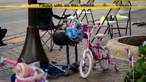 A child's bike, a scooter and chairs left at the scene of the mass shooting in Highland Park, Illinois. Photo: 4 July 2022