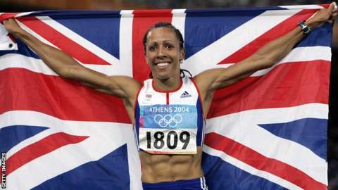 Kelly Holmes holds up the Union Jack after winning double Olympic gold at the 2004 Athens Games