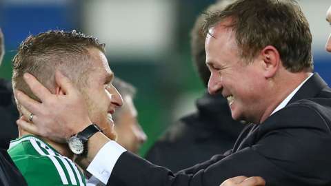 NI captain Steven Davis and manager Michael O'Neill celebrate qualifying for the Euro 2016 finals
