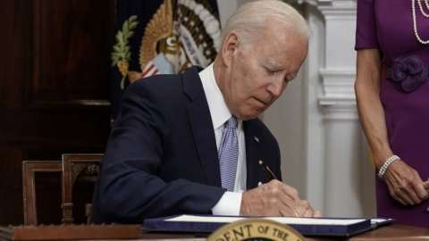 US President Joe Biden signs into law a gun control bill at the White House in Washington DC. Photo: 25 June 2022