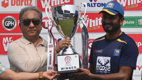 Sri Lanka captain Dimuth Karunaratne with the Test series trophy
