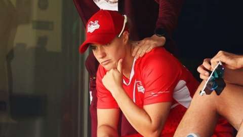 Katherine Brunt is consoled by injured England captain Heather Knight