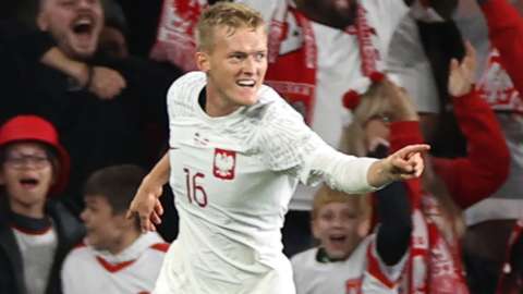 Karol Swiderski of Poland celebrates scoring a goal