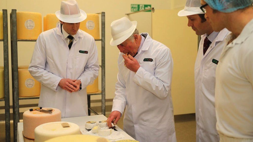 Prince of Wales tasting cheese.