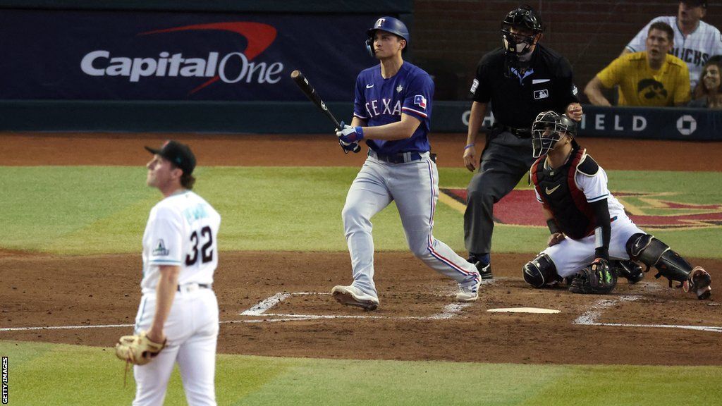 Texas Rangers' Corey Seager hits a home run off Arizona Diamondbacks pitcher Brandon Pfaadt