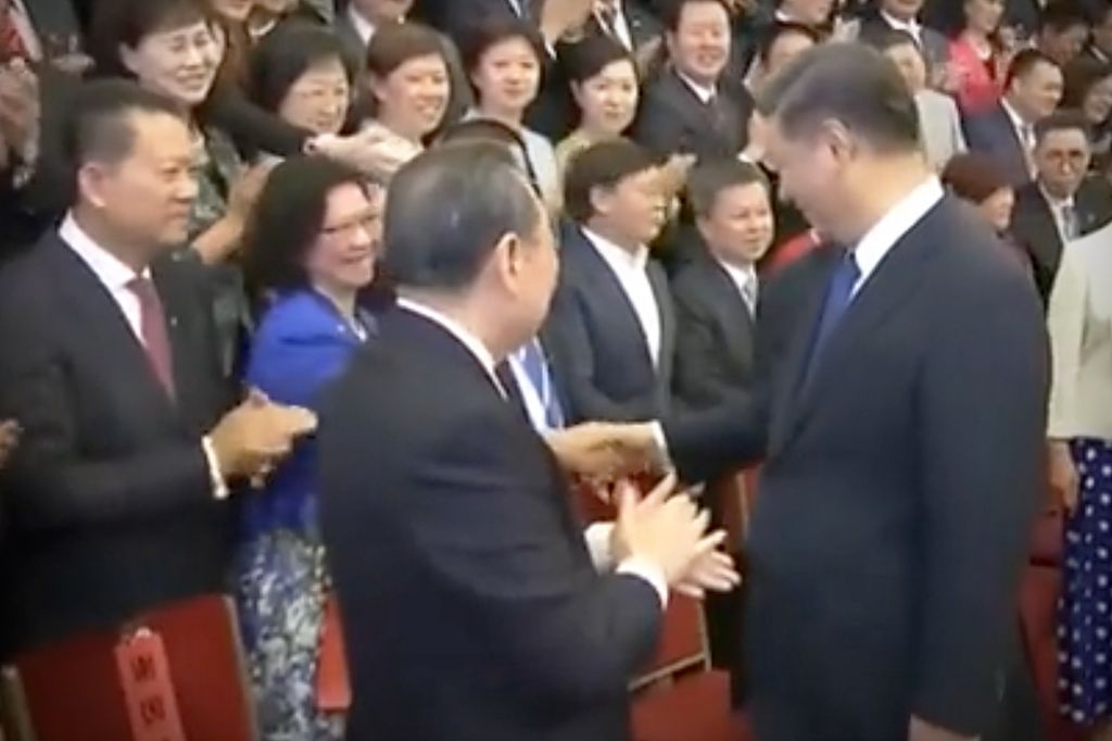 Christine Lee shaking hands with Chinese leader Xi Jinping in 2019