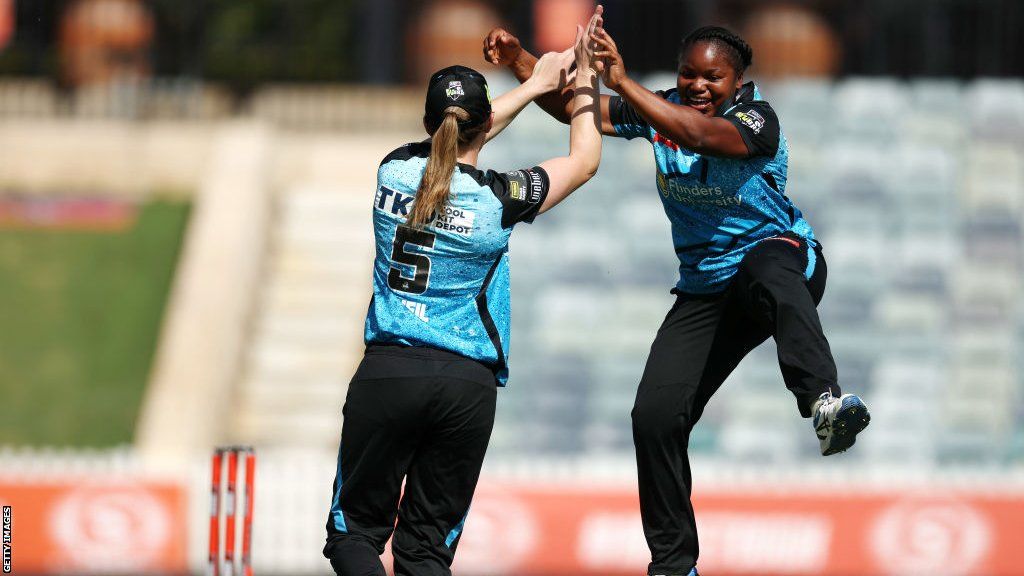 Anesu Mushangwe of the Strikers celebrates after taking the wicket of Ashleigh Gardner of the Sixers caught by Annie O'Neil of the Strikers during the WBBL