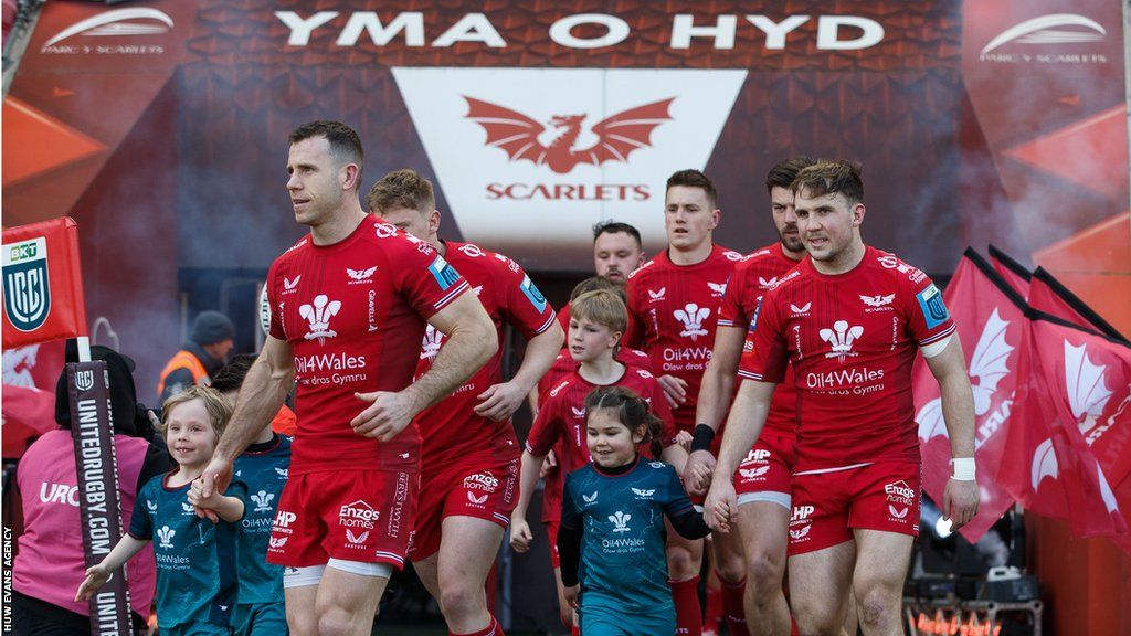 Gareth Davies leads out Scarlets against Benetton