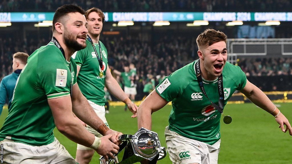 Jack Crowley and Robbie Henshaw celebrate with the Six Nations trophy