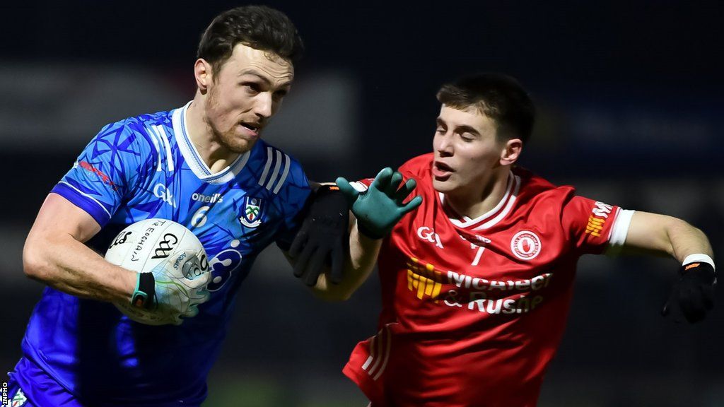 Niall Devlin (right) challenges Monaghan's Killian Lavelle in Saturday evening's game at Healy Park