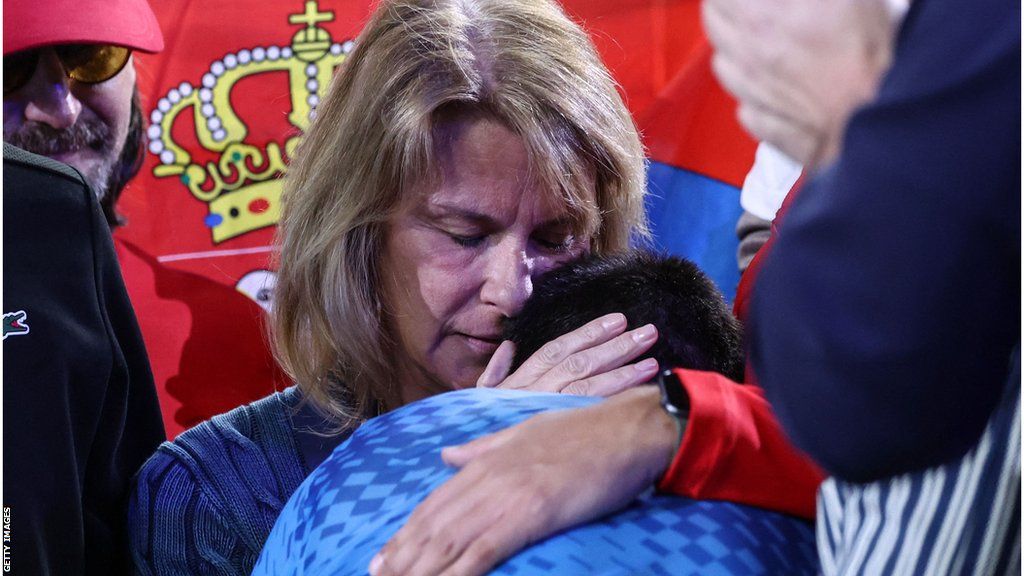 Novak Djokovic's mother, Diljana, hugs him after he won the Australian Open