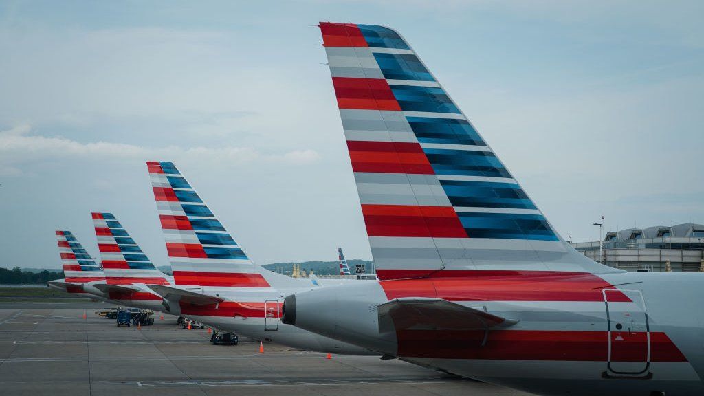 Tails of American Airline planes are seen as the planes sit parked at gates at Reagan National Airport on Thursday, April 27, 2023