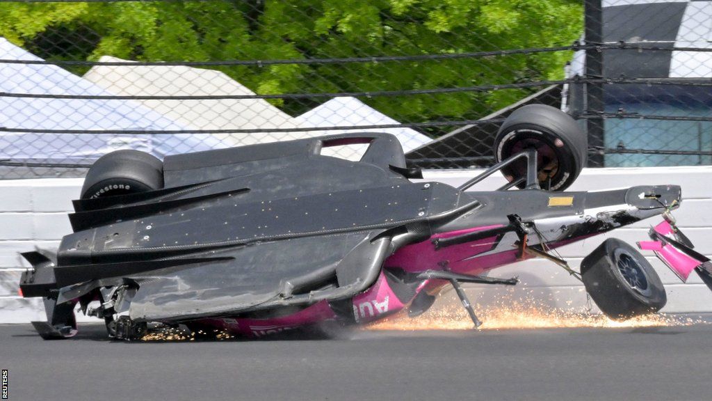 Kyle Kirkwood's car slides across the track after a crash