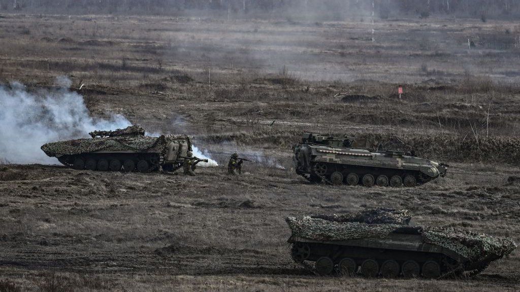 Ukrainian troops take part in a military drill outside the city of Rivne on February 16, 2022