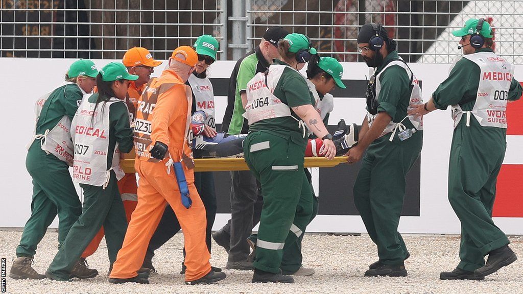 Jonathan Rea is stretchered off the circuit after crashing in Race Two at Phillip Island on Sunday