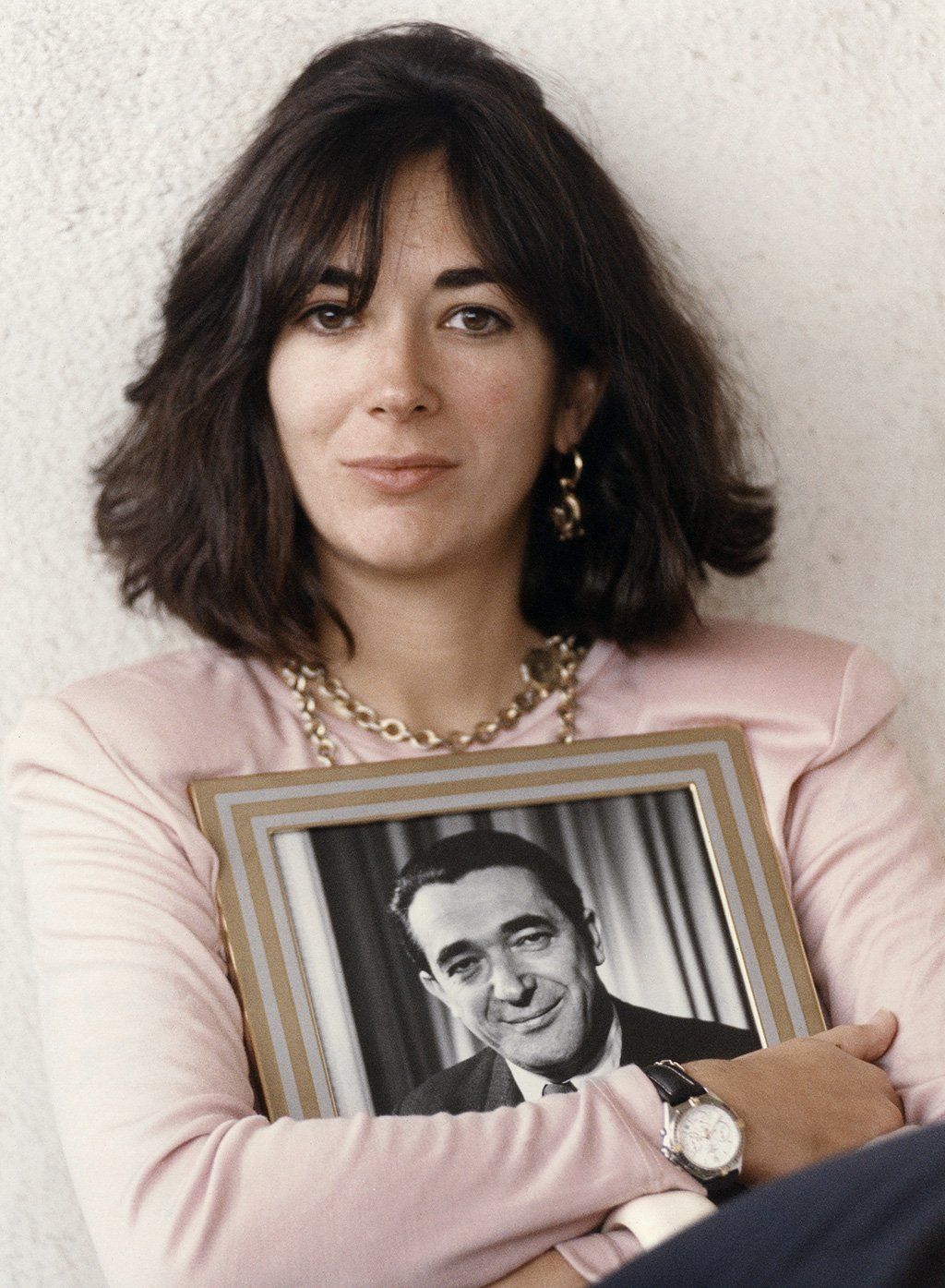 Ghislaine Maxwell, holding a framed photograph of her late father in Jerusalem, 1991