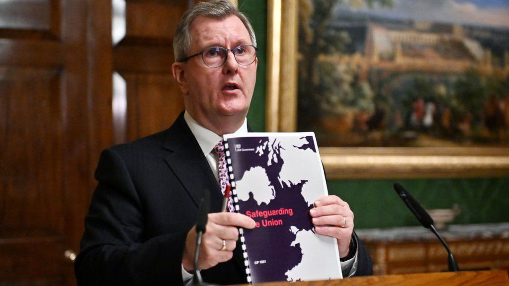 Sir Jeffrey Donaldson pictured on Wednesday with a copy of the Safeguarding the Union deal
