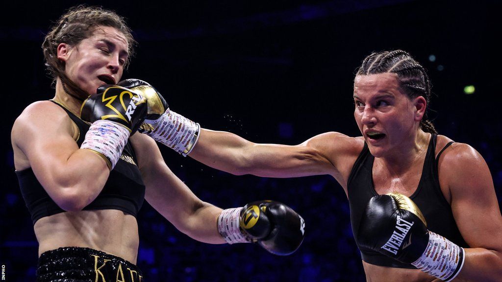 Katie Taylor reels from a Chantelle Cameron punch in the fight at the 3Arena in Dublin