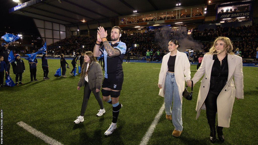 Josh Turnbull and family on pitch at Cardiff Arms Park