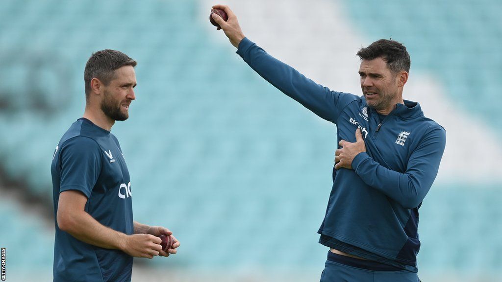 England bowlers Chris Woakes (left) and James Anderson (right) talk during training