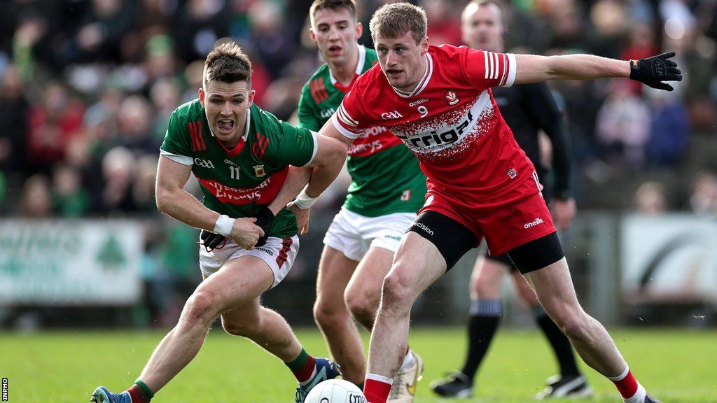 Derry's Brendan Rogers battles with Mayo's Fergal Boland