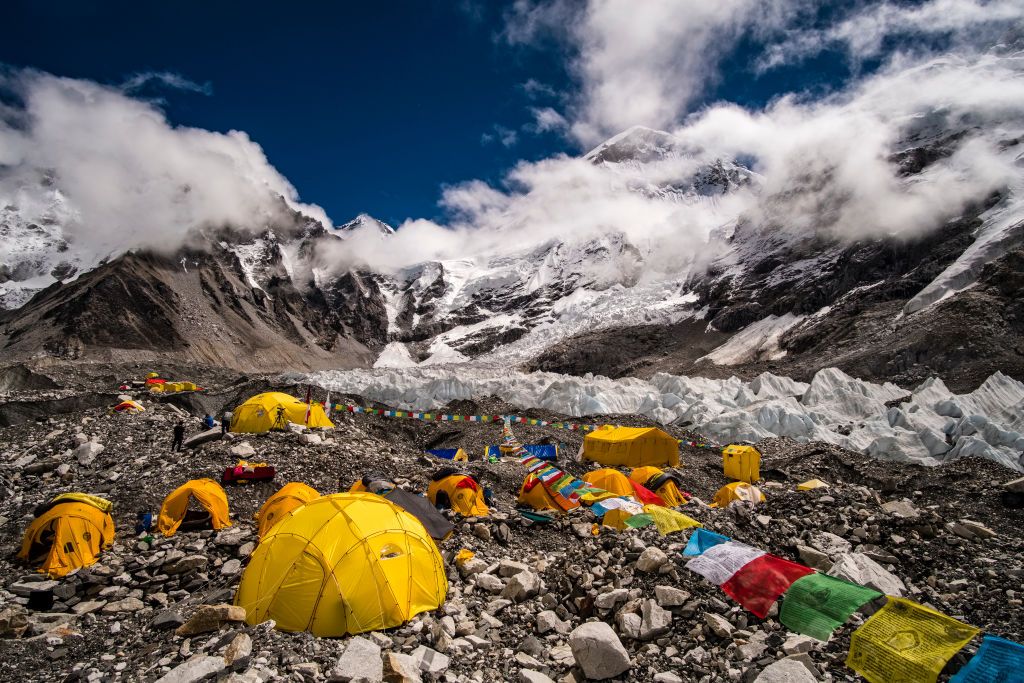 GORAKSHEP, SOLU KHUMBU, NEPAL - 2019/09/15: Tents set up at Everest Base Camp on Khumbu glacier, Mt. Everest behind covered by monsoon clouds. (Photo by Frank Bienewald/LightRocket via Getty Images)