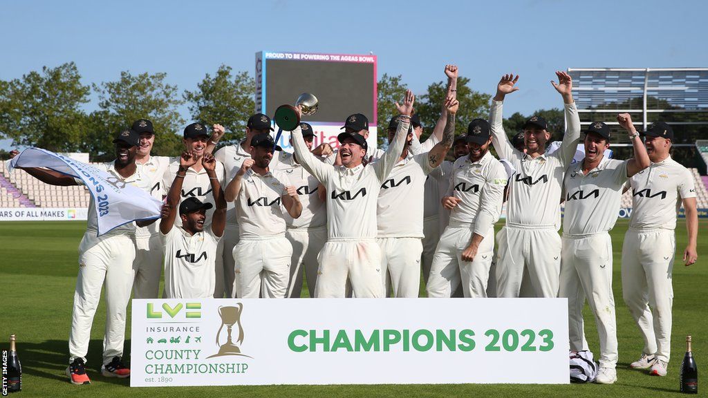 Surrey players celebrate their County Championship title win