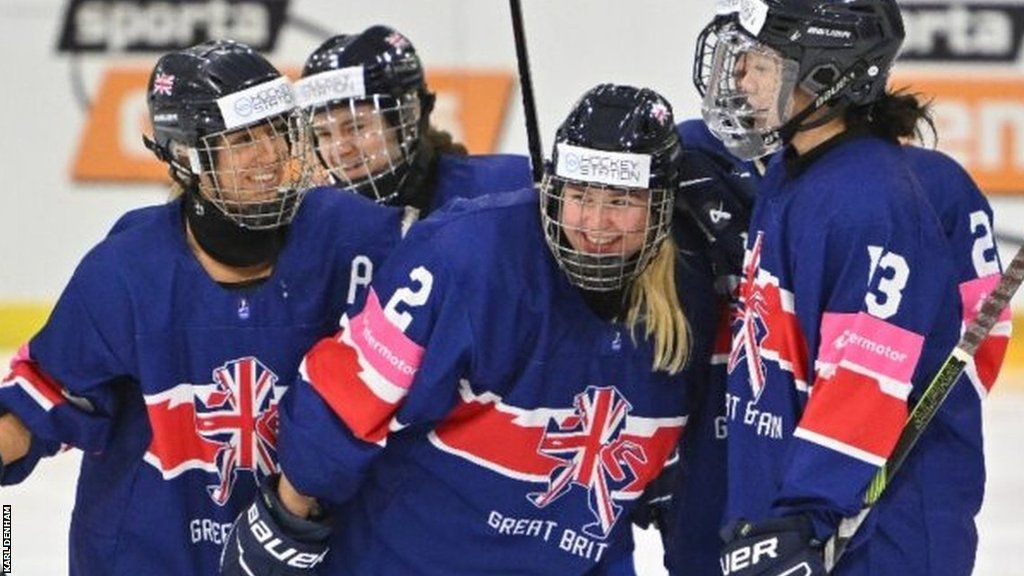 Great Britain women's team celebrate scoring against Poland at the Women's World Championship Division 1 Group B tournament in Riga