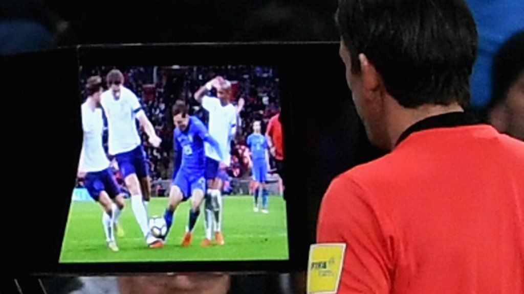 Referee views VAR footage