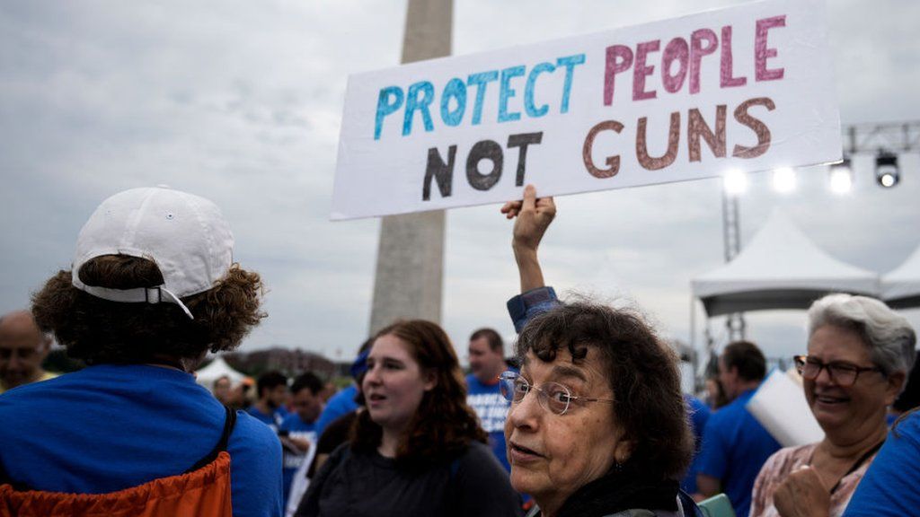 "Protect people not guns" - a sign at a rally in Washington