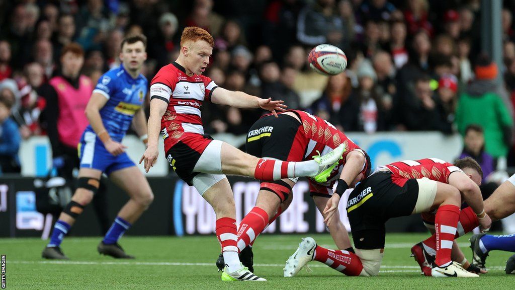 Caolan Englefield kicks the ball from a ruck for Gloucester during the Premiership Cup semi-final against Exeter