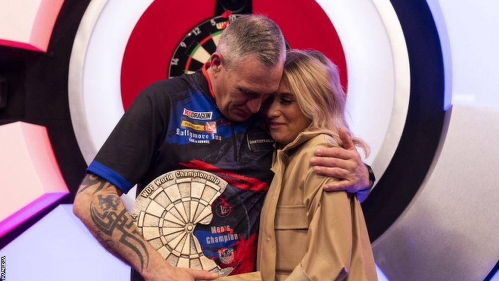 Neil Duff celebrates winning the WDF World Championship along his his daughter Hayley on her 18th birthday