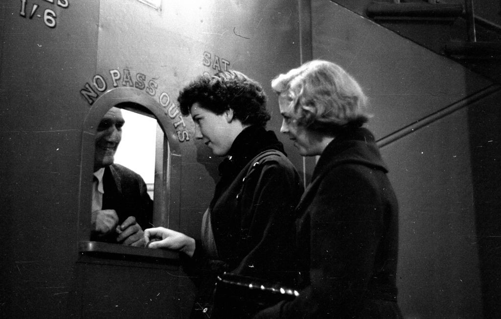 Two women buying cinema tickets in Kilmarnock