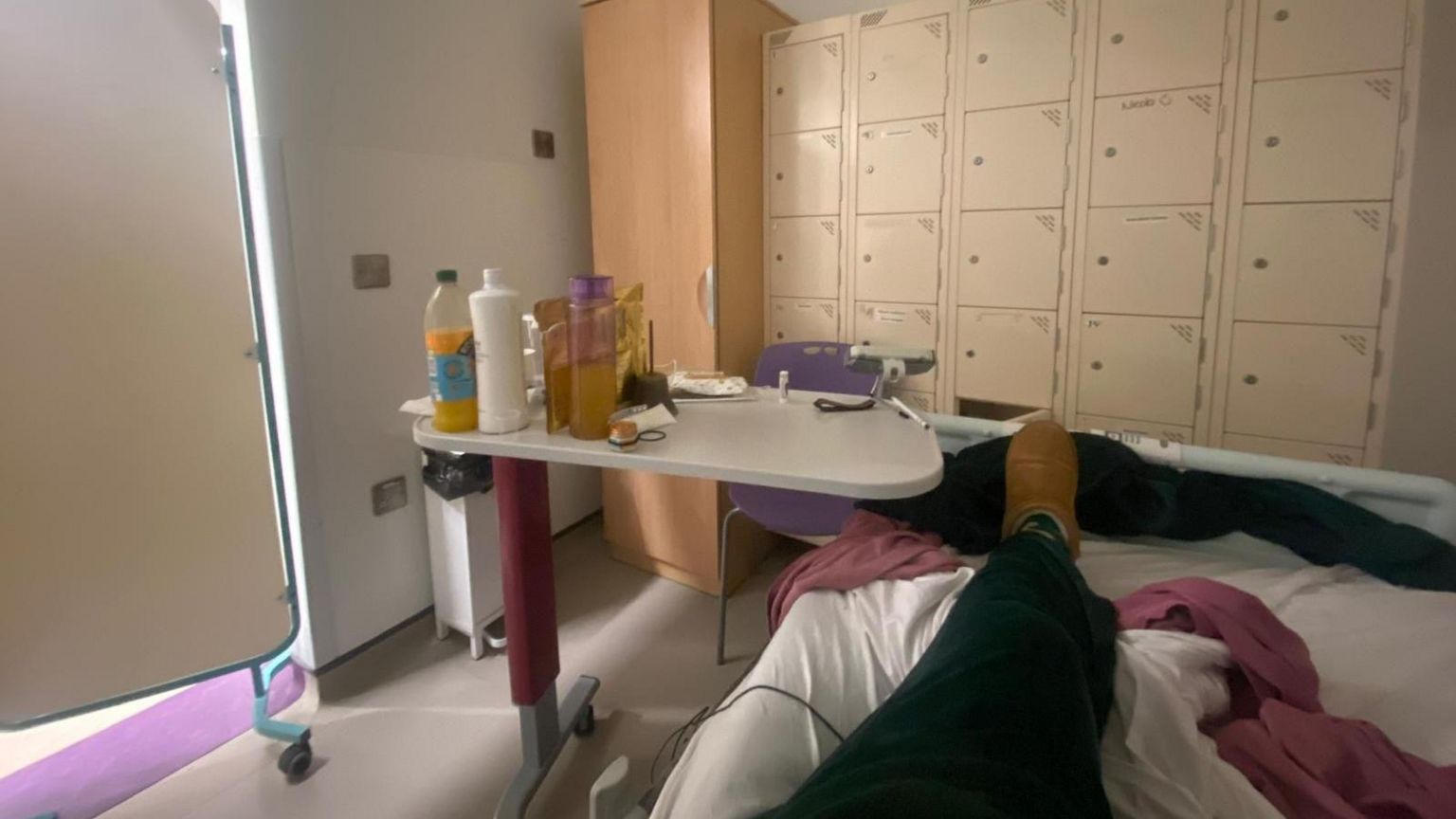 A makeshift bed in a hospital locker room