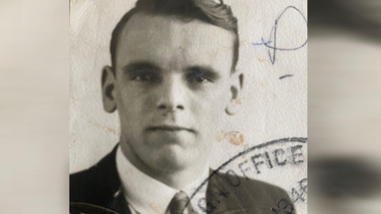 A passport photo of John as a young man, taken in 1946