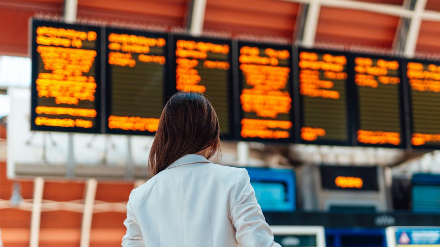 A woman at a train station 