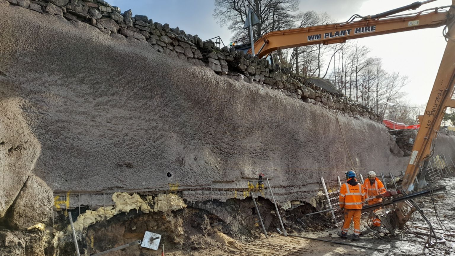 Workmen repairing a bank