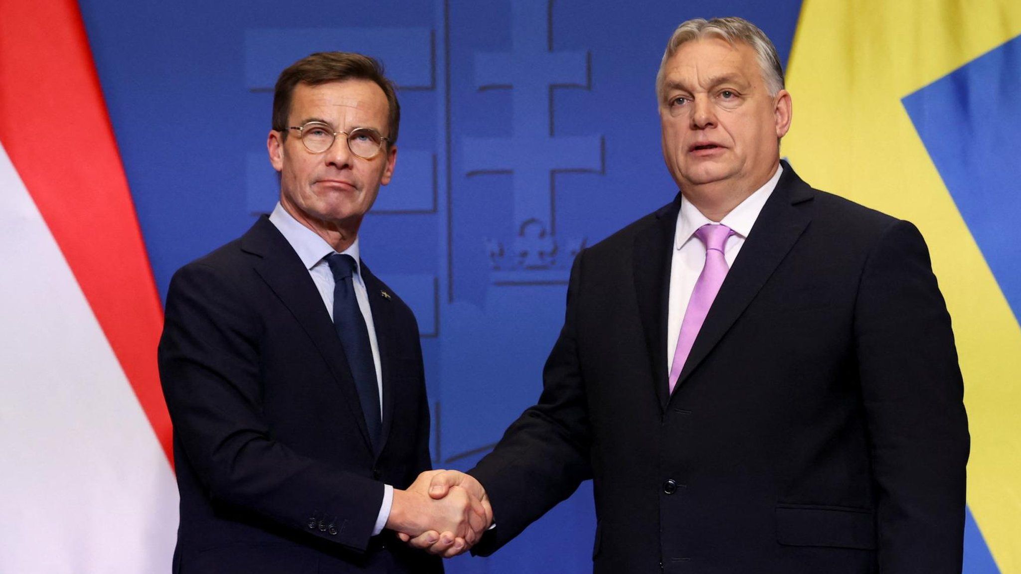 Swedish Prime Minister Ulf Kristersson and Hungarian Prime Minister Viktor Orban shake hands at a joint press conference in Budapest, Hungary, February 23, 2024