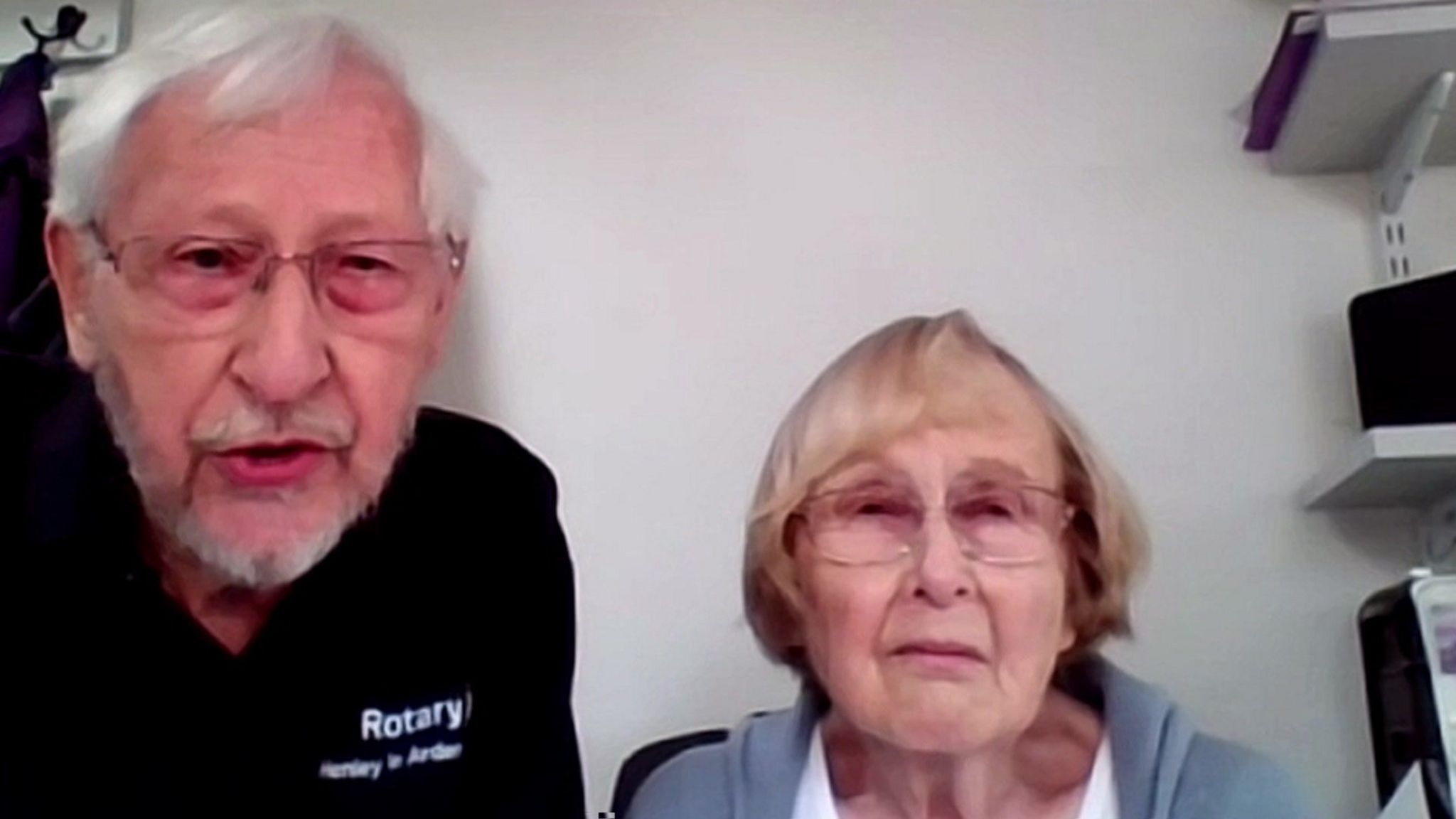 An elderly couple on zoom