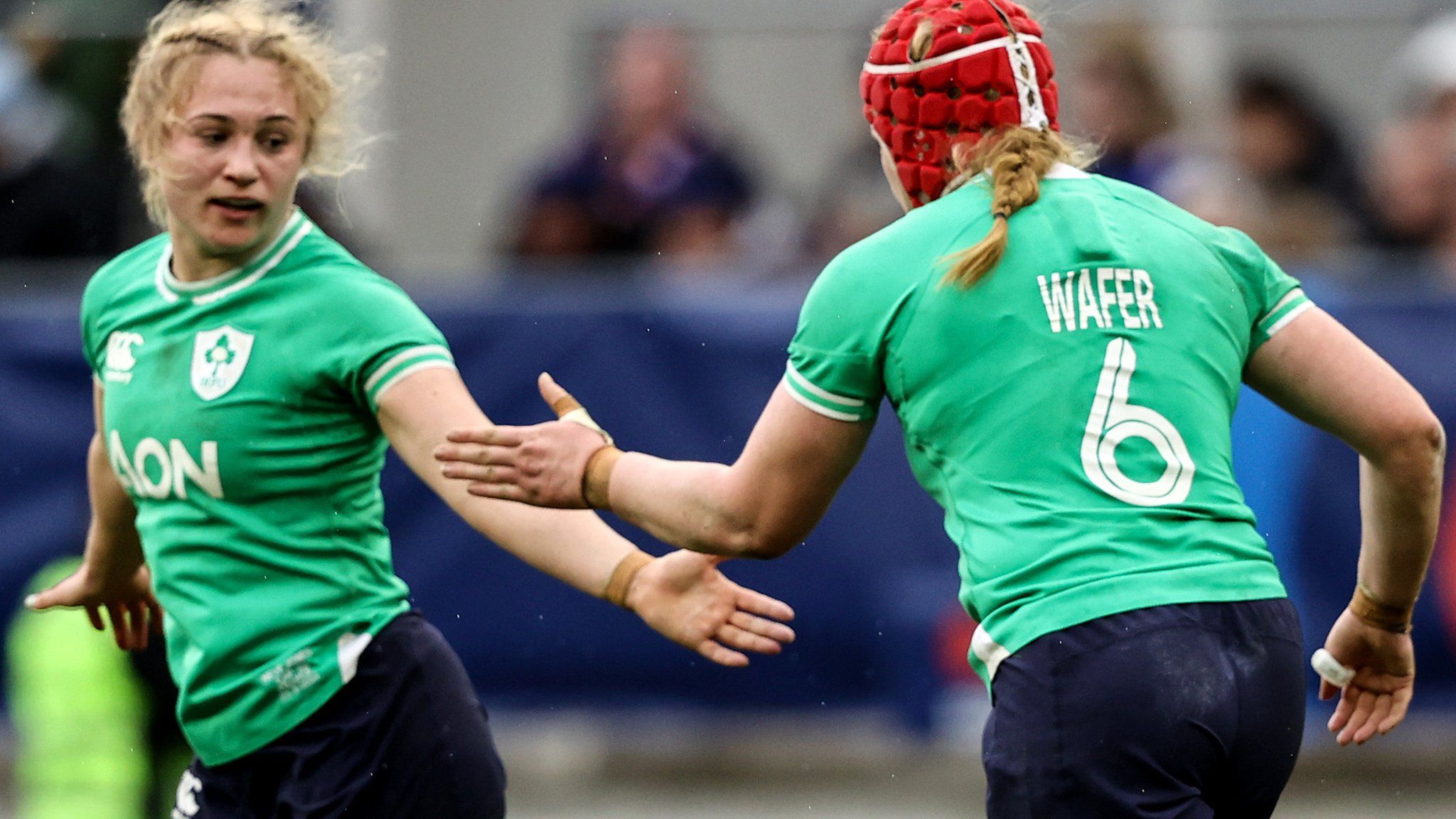 Aoife Wafer celebrates scoring Ireland's opening try with Neve Jones