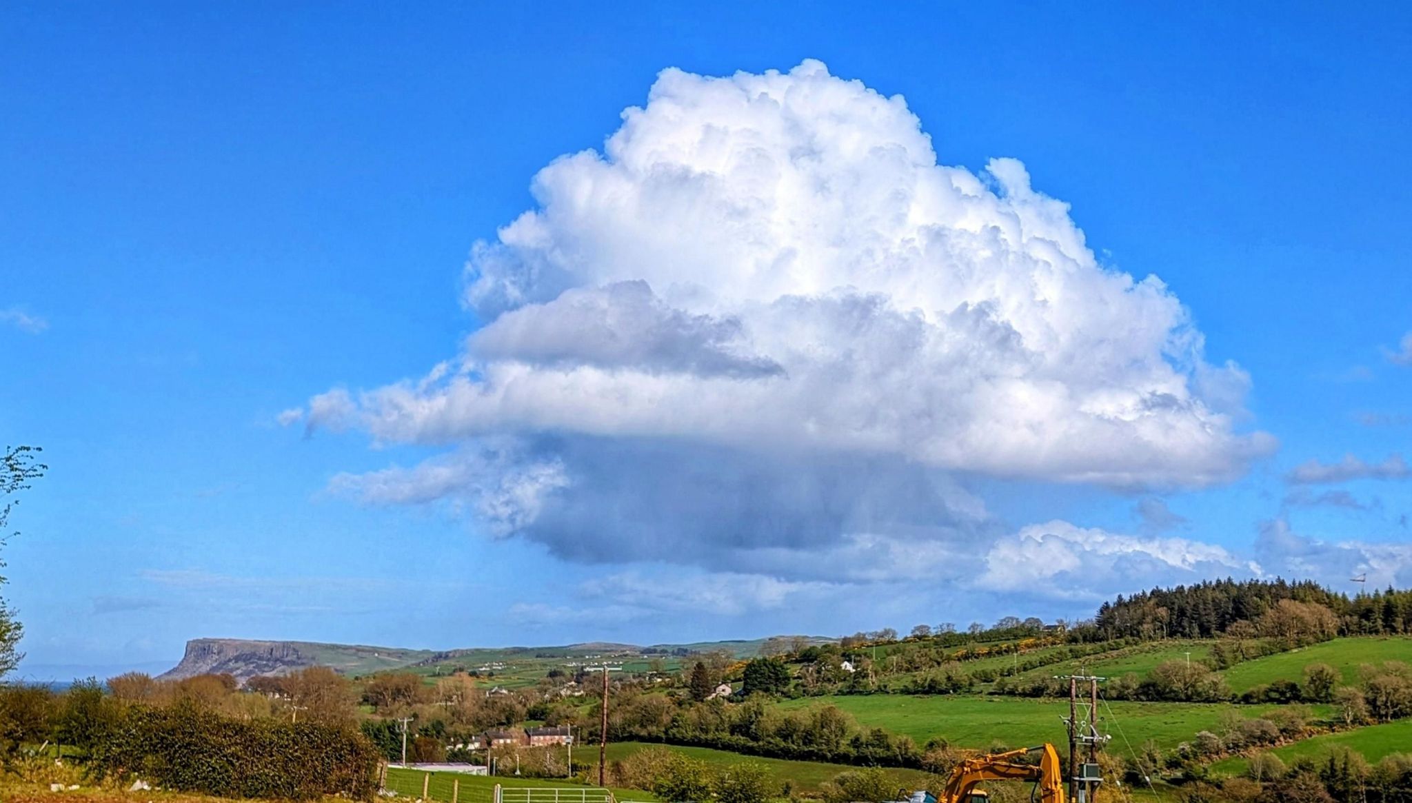 Cumulus cloud above a rural landscape in Ballycastle, County Antrim