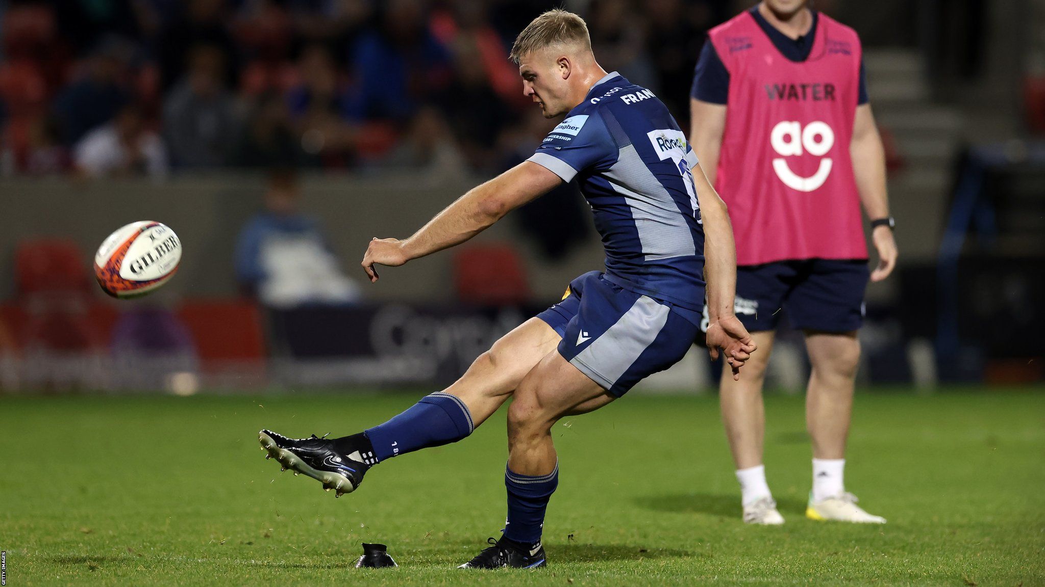 Tom Curtis of Sale Sharks kicks a conversion during the Sale Sharks v Leicester Tigers - Premiership Rugby Cup match at AJ Bell Stadium on September 15, 2023 in Salford, England. (