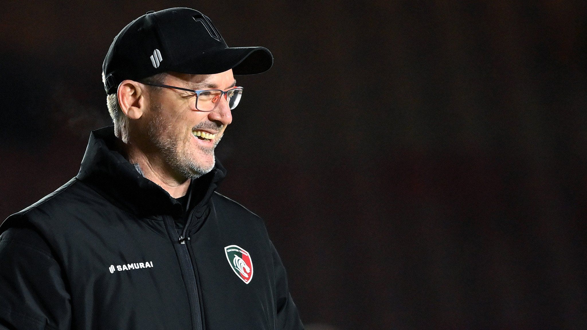 Leicester Tigers head coach Dan McKellar smiles before a game