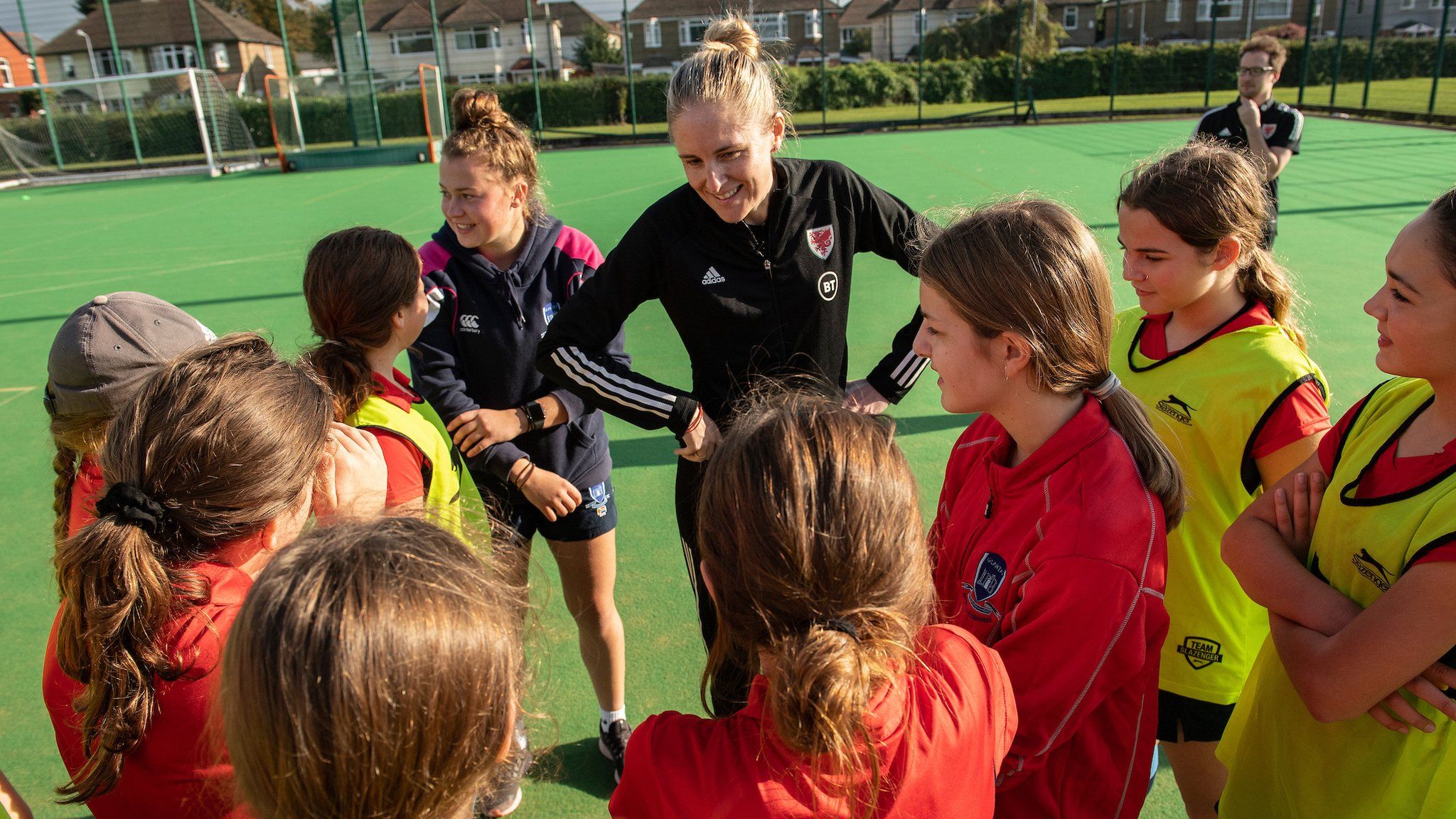 Wales manager with young female footballers