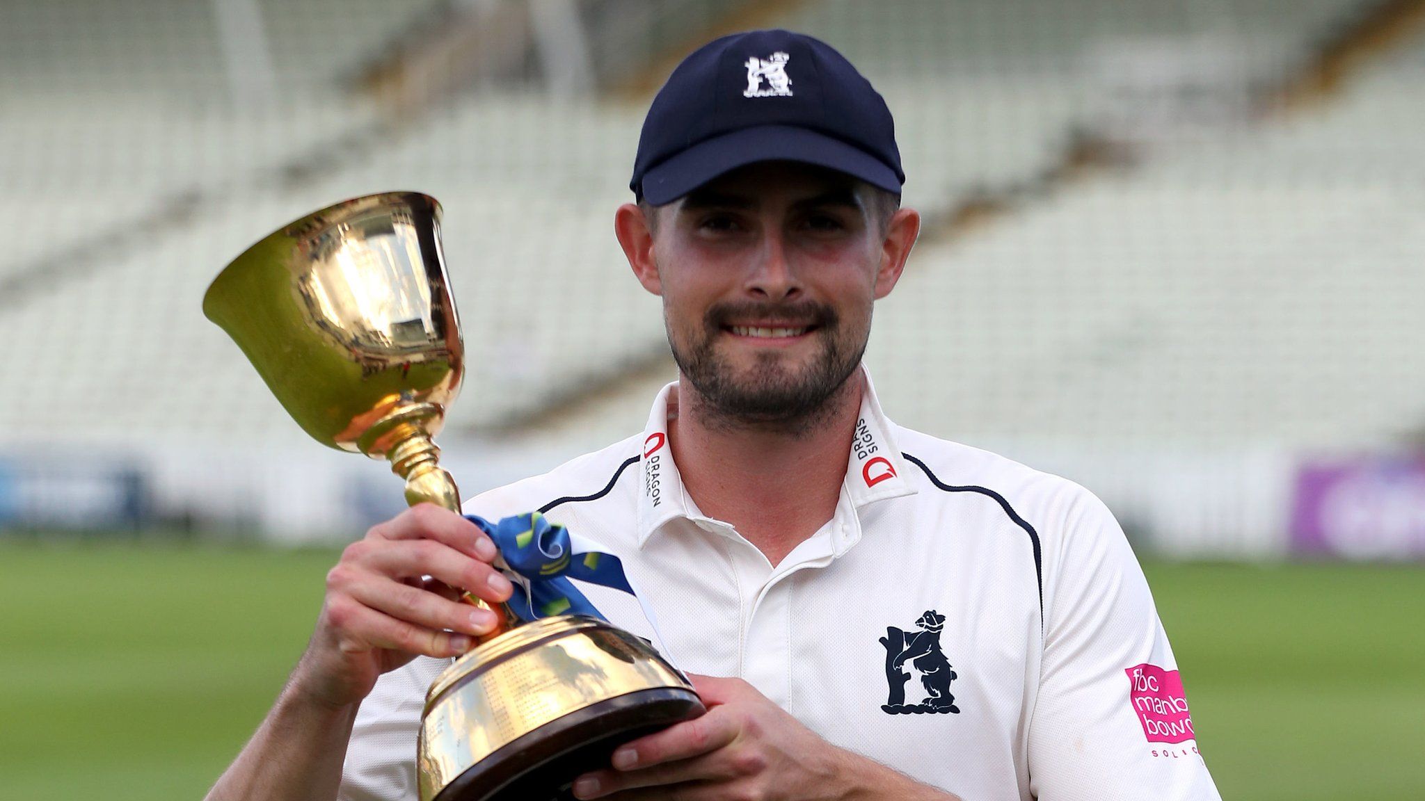 Warwickshire captain Will Rhodes with the County Championship trophy