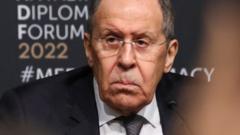 A handout photo made available by the press service of the Russian Foreign Affairs Ministry shows Russian Foreign Minister Sergei Lavrov attending a news conference following a tripartite meeting with Ukrainian Foreign Minister Dmytro Kuleba