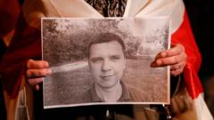 Плакат с портретом Андрея Зельцера на акции в Киеве 30 сентября