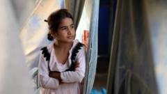 Девочка в лагере беженцев