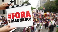 A demonstrator holds a sign that says 'Bolsonaro out'