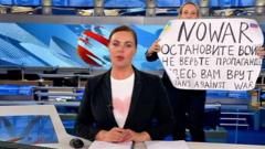 Protester on set of the 'Vremya' news programme